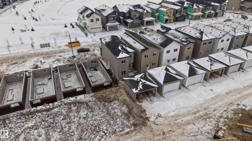 Snowy aerial view featuring a residential view - 430 Crystal Creek Link, Leduc, AB - Outdoor