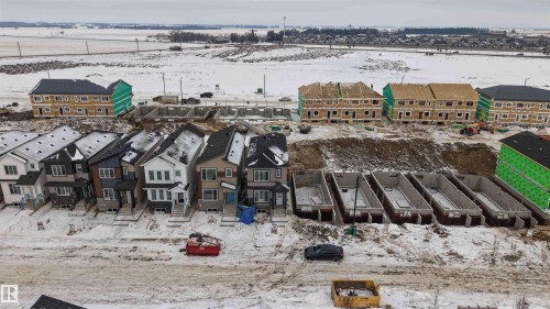 Snowy aerial view with a residential view - 430 Crystal Creek Link, Leduc, AB - Outdoor