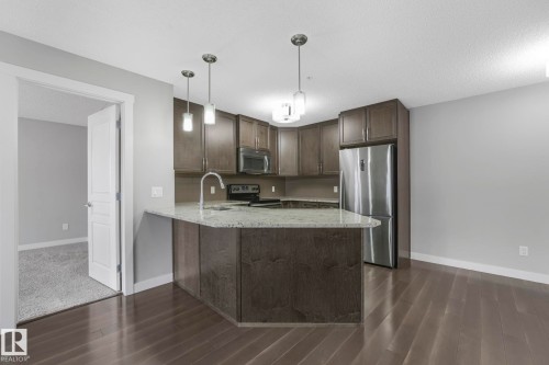 115 2207 44 Avenue, Edmonton, AB - Indoor Photo Showing Kitchen With Stainless Steel Kitchen