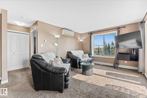 402 11803 22 Avenue, Edmonton, AB - Indoor Photo Showing Living Room