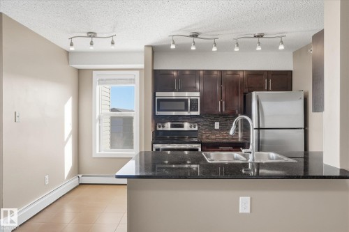 402 11803 22 Avenue, Edmonton, AB - Indoor Photo Showing Kitchen With Double Sink