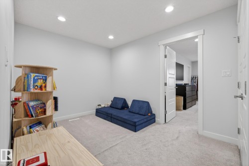 Living area with light carpet and recessed lighting - 17727 13 Avenue, Edmonton, AB - Indoor