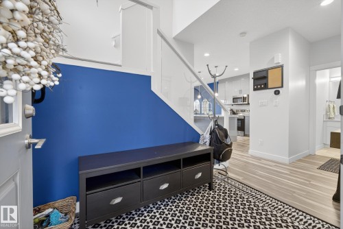 Entryway with light wood-style flooring and recessed lighting - 17727 13 Avenue, Edmonton, AB - Indoor Photo Showing Other Room