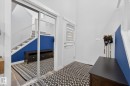Entrance foyer with healthy amount of natural light, stairway, and tile patterned floors - 17727 13 Avenue, Edmonton, AB  - Indoor Photo Showing Other Room 