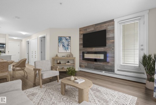 109 5804 Mullen Place, Edmonton, AB - Indoor Photo Showing Living Room With Fireplace