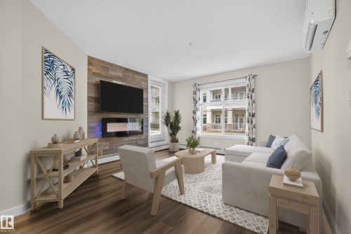 109 5804 Mullen Place, Edmonton, AB - Indoor Photo Showing Living Room With Fireplace