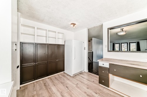 Interior space with light wood-style floors - 131 Saskatchewan Avenue W, Devon, AB - Indoor