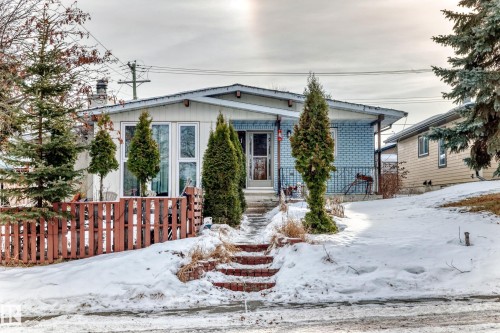 View of front of property with brick siding and a chimney - 131 Saskatchewan Avenue W, Devon, AB - Outdoor