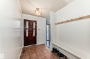 Mudroom featuring a textured ceiling and tile patterned flooring - 131 Saskatchewan Avenue W, Devon, AB  - Indoor Photo Showing Other Room 