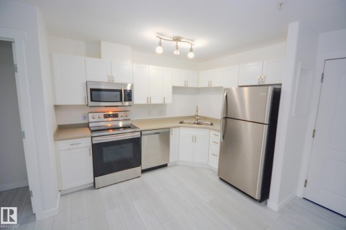 116 12550 140 Avenue, Edmonton, AB - Indoor Photo Showing Kitchen With Stainless Steel Kitchen With Double Sink