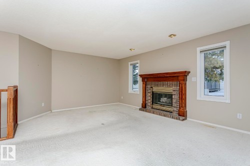 3240 38 Avenue, Edmonton, AB - Indoor Photo Showing Living Room With Fireplace