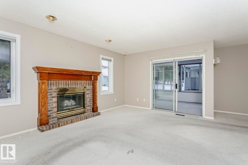 3240 38 Avenue, Edmonton, AB - Indoor Photo Showing Living Room With Fireplace