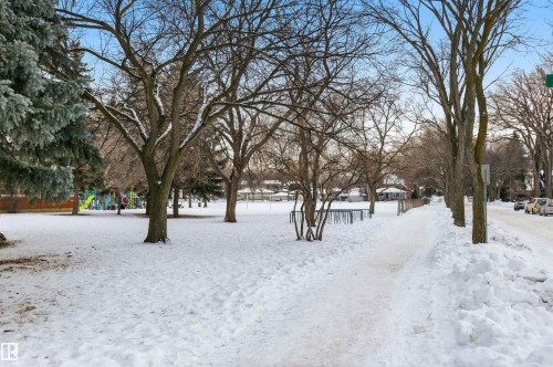View of snowy yard across the street. - 10332 82 Street, Edmonton, AB - Outdoor With View