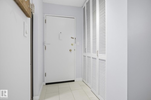 Entryway featuring baseboards and tile patterned flooring - 1513 13910 Stony Plain Road, Edmonton, AB - Indoor Photo Showing Other Room
