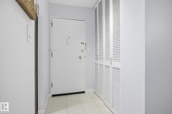 Entryway featuring baseboards and tile patterned flooring - 