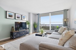 Living area with wood finished floors and baseboards - 