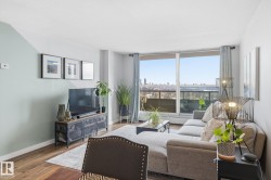 Living area with wood finished floors and baseboards - 