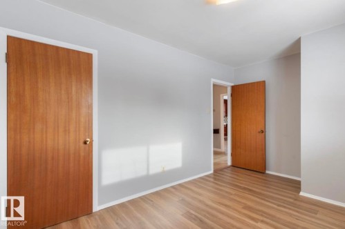 Unfurnished bedroom with wood finished floors and a closet - 3810 110 Avenue, Edmonton, AB - Indoor Photo Showing Other Room