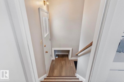 Stairway featuring baseboards and wood finished floors - 3810 110 Avenue, Edmonton, AB - Indoor Photo Showing Other Room
