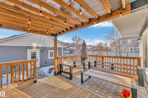 Wooden deck featuring a residential view - 7613 16 Ave Sw, Edmonton, AB - Outdoor With Deck Patio Veranda With Exterior