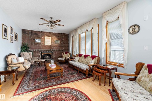 93 Cormack Crescent, Edmonton, AB - Indoor Photo Showing Living Room With Fireplace