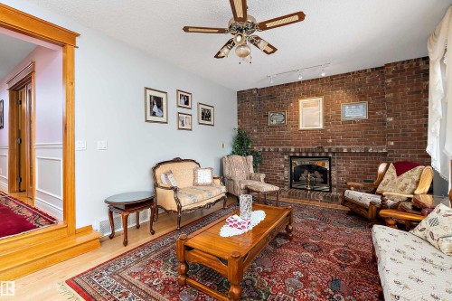 93 Cormack Crescent, Edmonton, AB - Indoor Photo Showing Living Room With Fireplace