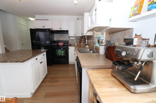 75 120 Magrath Road, Edmonton, AB - Indoor Photo Showing Kitchen With Double Sink