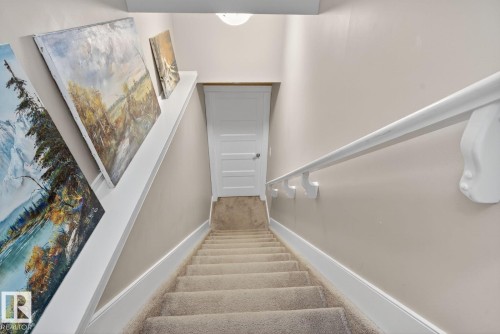 Staircase featuring carpet and baseboards - 9858 72 Avenue, Edmonton, AB - Indoor Photo Showing Other Room