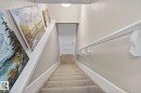 Staircase featuring carpet and baseboards - 9858 72 Avenue, Edmonton, AB  - Indoor Photo Showing Other Room 