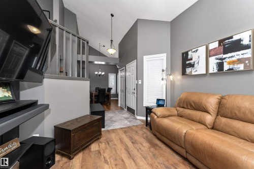 Living area featuring laminate flooring, and high vaulted ceiling - 5628 188A Street, Edmonton, AB - Indoor Photo Showing Other Room