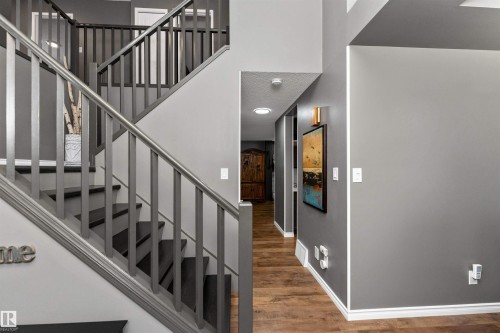 Staircase featuring laminate flooring and a high ceiling - 5628 188A Street, Edmonton, AB - Indoor Photo Showing Other Room