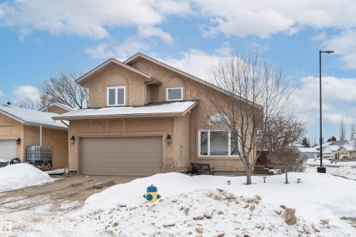 View of front of house featuring stucco siding and a garage - 5628 188A Street, Edmonton, AB - Outdoor With Facade