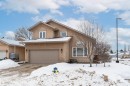 View of front of house featuring stucco siding and a garage - 5628 188A Street, Edmonton, AB  - Outdoor With Facade 
