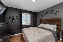 Bedroom upstairs featuring laminate flooring - 