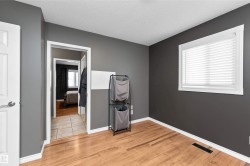 Bedroom upstairs featuring laminate flooring - 