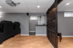 Wet bar with sink and fridge located conveniently in the theatre room - 