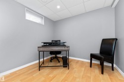 basement bedroom with laminate flooring - 