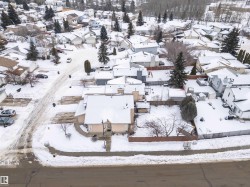 Snowy aerial view featuring a residential view - 