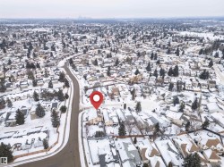 Aerial view of property's location with nearby suburban area - 