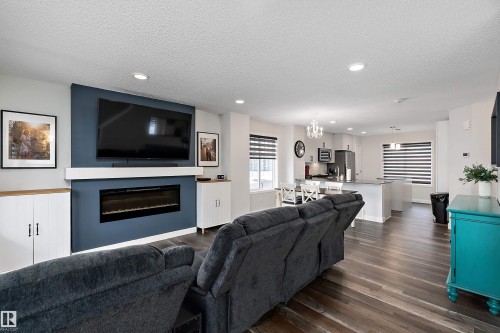 1 3305 Orchards Link, Edmonton, AB - Indoor Photo Showing Living Room With Fireplace