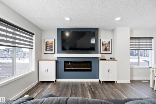 1 3305 Orchards Link, Edmonton, AB - Indoor Photo Showing Living Room With Fireplace