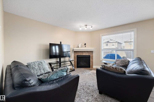 2407 Casselman Crescent, Edmonton, AB - Indoor Photo Showing Living Room With Fireplace