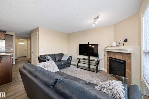 2407 Casselman Crescent, Edmonton, AB - Indoor Photo Showing Living Room With Fireplace
