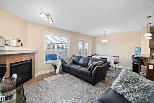 2407 Casselman Crescent, Edmonton, AB - Indoor Photo Showing Living Room With Fireplace
