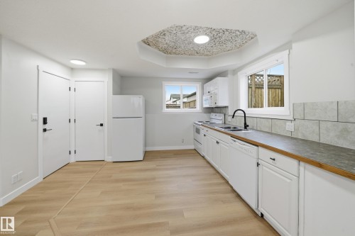 120 Premiere Crescent, Blackfalds, AB - Indoor Photo Showing Kitchen With Double Sink