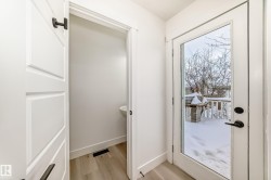 Entryway with wood finished floors and baseboards - 