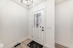 Entryway featuring light wood-type flooring and baseboards - 