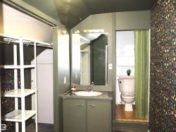 Full bathroom featuring toilet and vanity - 