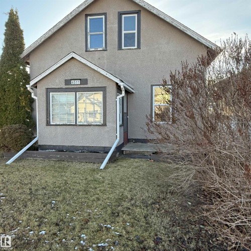 View of front of house with a front yard and stucco siding - 4511 53 Ave, Barrhead, AB - Outdoor