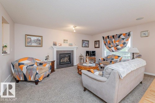 6227 5 Avenue, Edmonton, AB - Indoor Photo Showing Living Room With Fireplace